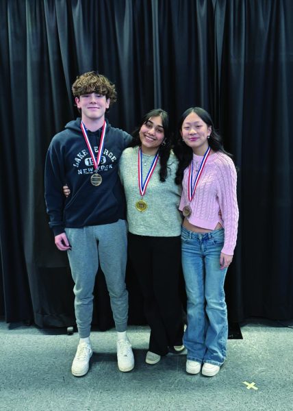 Poetry Out Loud winners, second place Jake Wilson, first place Danya Zaidi, and third place Fiona Zheng