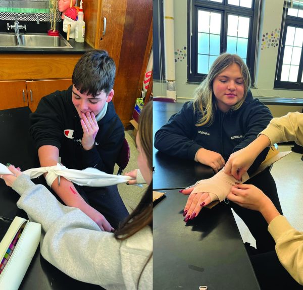 Students practice using splints and tourniquets.